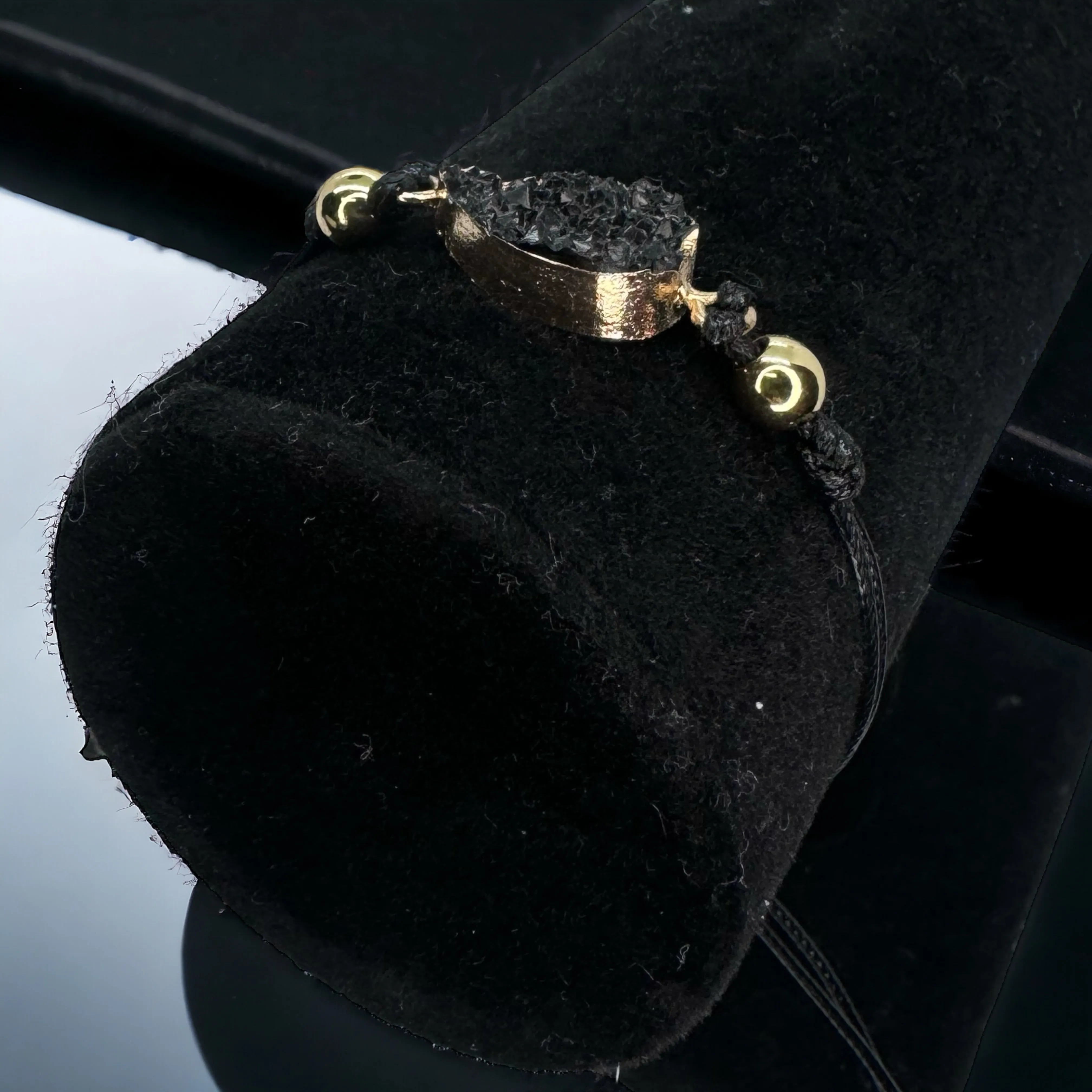 Black Leather Bracelet with Gold and Black Charm