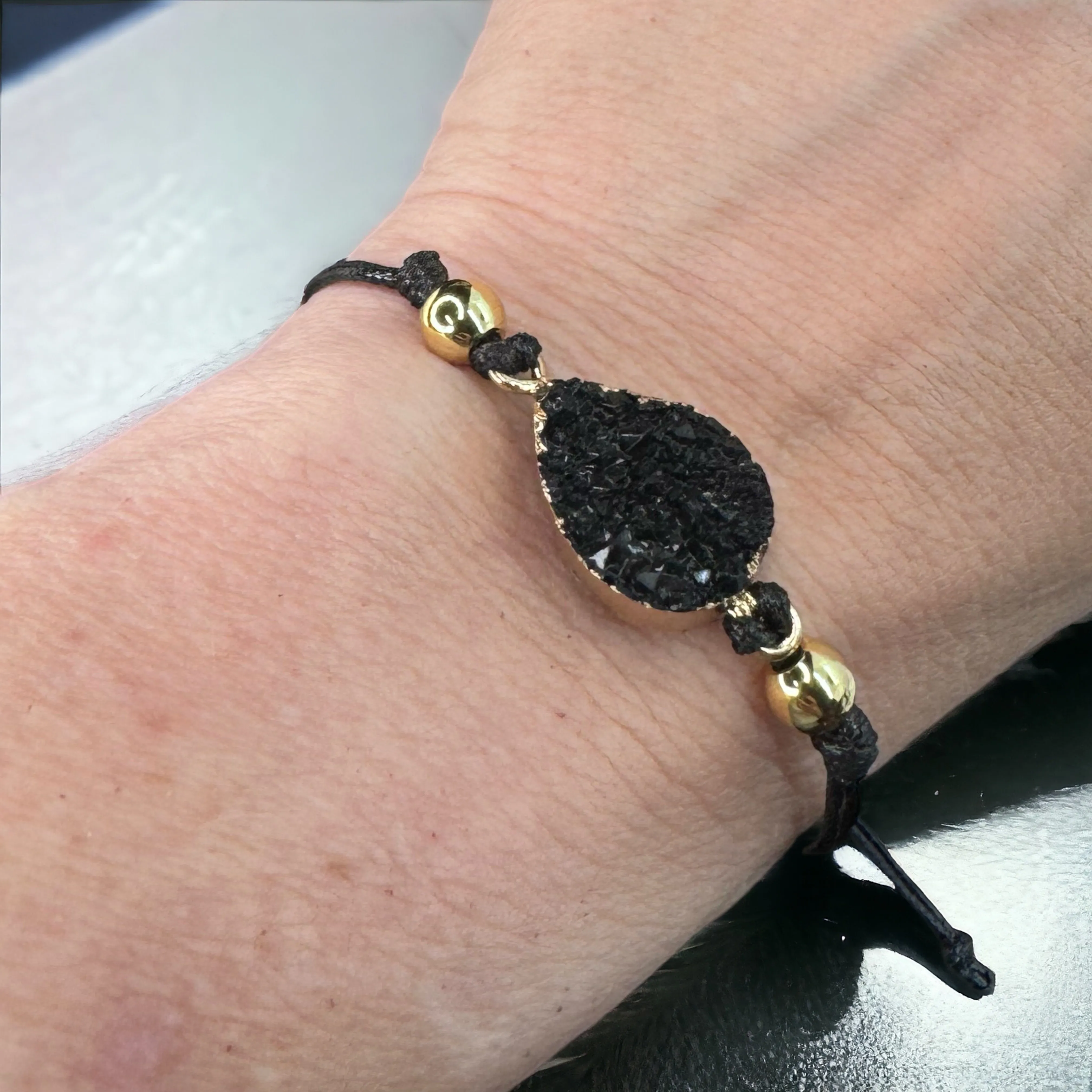Black Leather Bracelet with Gold and Black Charm