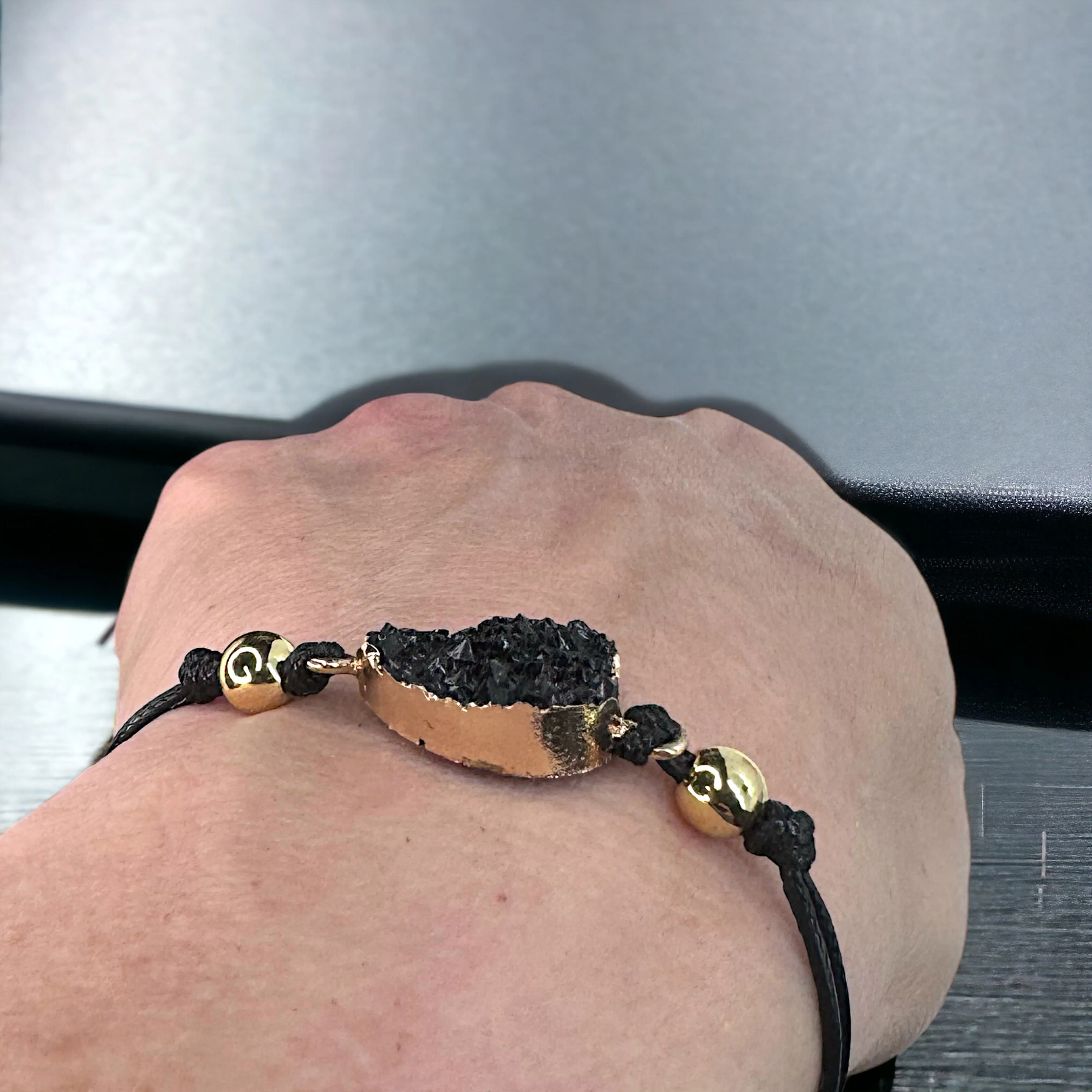 Black Leather Bracelet with Gold and Black Charm