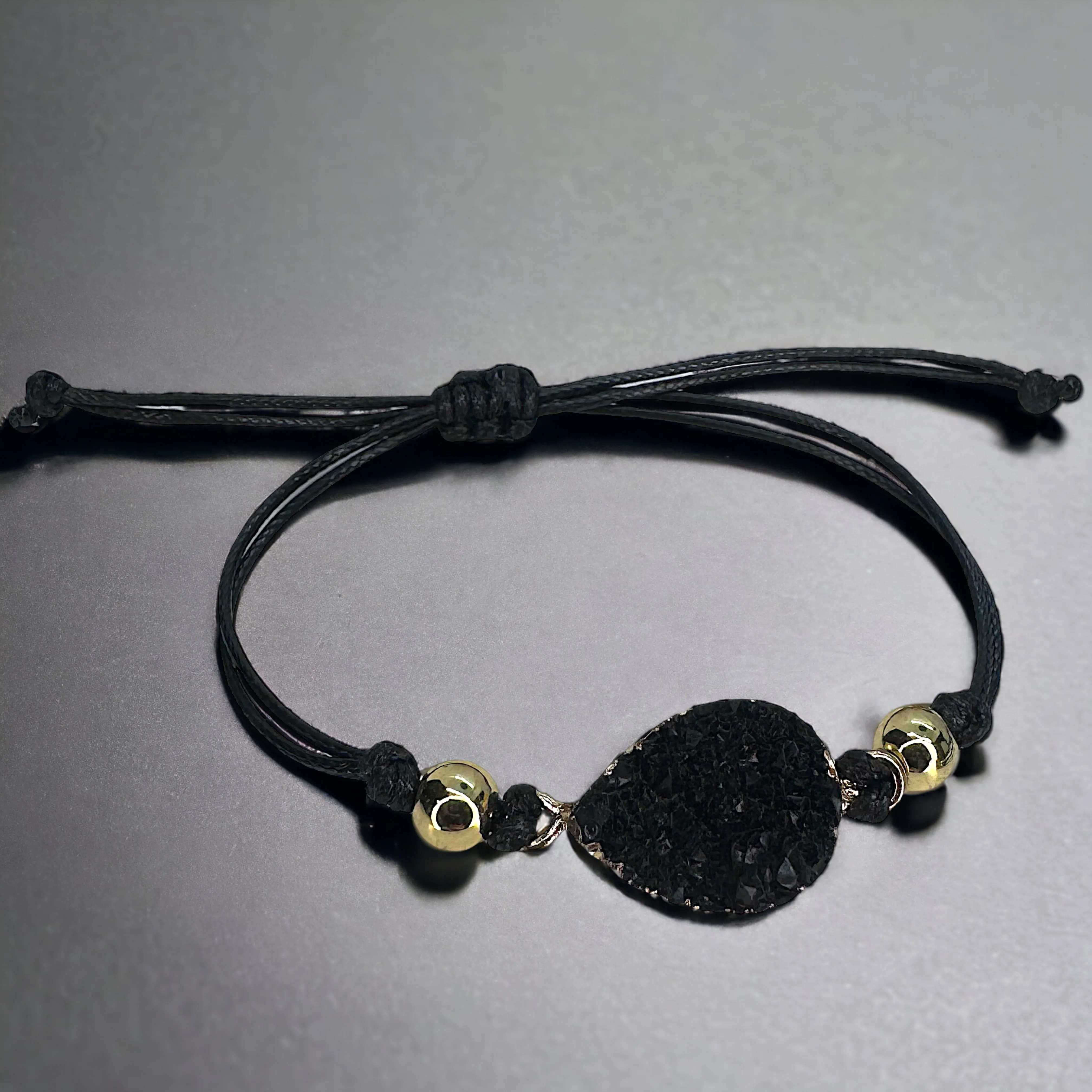 Black Leather Bracelet with Gold and Black Charm