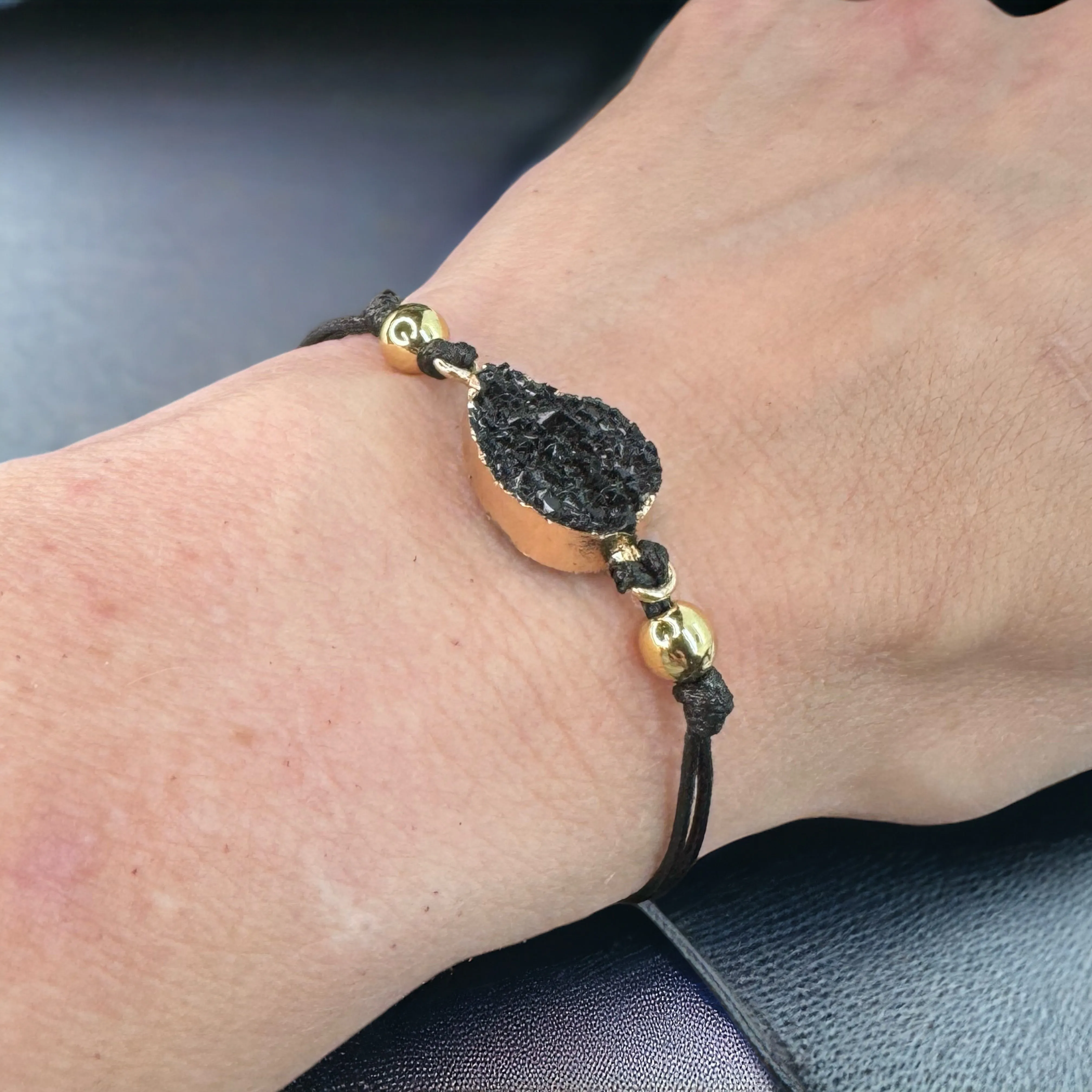 Black Leather Bracelet with Gold and Black Charm