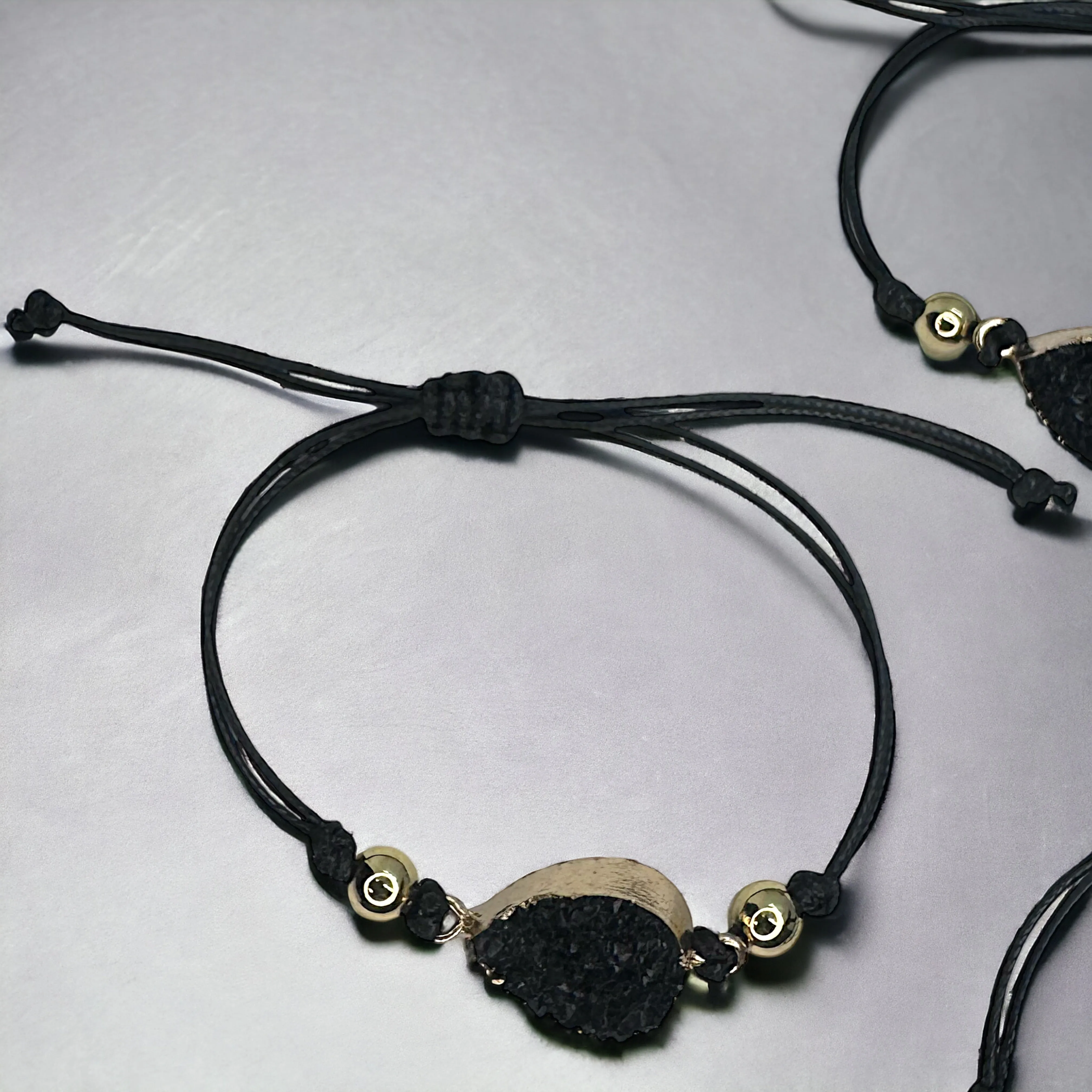Black Leather Bracelet with Gold and Black Charm